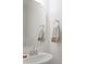 Elegant powder room featuring a stylish mirror, towel ring and sleek sink with chrome faucet at 5109 Arbordale Way, Mount Holly, NC 28120