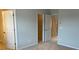 Spacious bedroom features neutral carpeting and multiple doorways at 534 Dorman St, Belmont, NC 28012