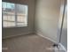 Bedroom with neutral walls, carpet, and a view from the large window at 534 Dorman St, Belmont, NC 28012