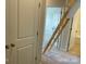 Hallway with closet and wooden folding ladder to attic at 534 Dorman St, Belmont, NC 28012
