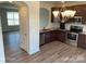 Open kitchen with modern lighting, stainless steel appliances, and eat-in counter at 534 Dorman St, Belmont, NC 28012
