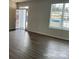 Living room with window, plank flooring, open floor plan and white walls at 534 Dorman St, Belmont, NC 28012
