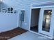 Outdoor patio with fenced-in yard, exterior door, and ample lighting at 534 Dorman St, Belmont, NC 28012