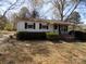 Charming single-story home with a covered porch and mature landscaping, offering a welcoming curb appeal at 543 Queens Rd, Gastonia, NC 28052