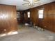 Living room featuring wood paneling at 543 Queens Rd, Gastonia, NC 28052