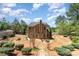 Spacious backyard with a patio, landscaping, and a storage shed at 6010 Hawk View Rd, Waxhaw, NC 28173