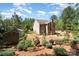 An elevated view of the spacious backyard with landscaping and a storage shed at 6010 Hawk View Rd, Waxhaw, NC 28173