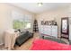 Cozy bedroom features natural light and a comfortable seating area at 6010 Hawk View Rd, Waxhaw, NC 28173