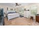 Bright bedroom boasts natural light and a neutral color scheme at 6010 Hawk View Rd, Waxhaw, NC 28173
