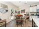 Cozy dining area adjacent to kitchen features a breakfast table, chairs, and a door to the exterior at 6010 Hawk View Rd, Waxhaw, NC 28173