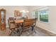 Bright dining room featuring a modern light fixture, a large window and stylish furnishings at 6010 Hawk View Rd, Waxhaw, NC 28173