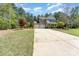 Charming two-story home featuring a two-car garage, a covered front porch, and a spacious front yard at 6010 Hawk View Rd, Waxhaw, NC 28173