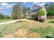 Charming two-story home featuring a two-car garage, a covered front porch, and a well-manicured lawn at 6010 Hawk View Rd, Waxhaw, NC 28173