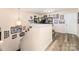 Second story hallway with hardwood flooring and an array of sports-themed memorabilia at 6010 Hawk View Rd, Waxhaw, NC 28173