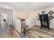 Upstairs landing featuring hardwood flooring and an exercise treadmill at 6010 Hawk View Rd, Waxhaw, NC 28173