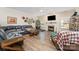 Spacious living room with a fireplace, TV, comfortable seating, and laminate wood flooring at 6010 Hawk View Rd, Waxhaw, NC 28173