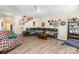 Inviting living room with a plush sectional, decorative wall art, and access to stairs at 6010 Hawk View Rd, Waxhaw, NC 28173