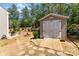 Outdoor shed with double doors and a wood plank ramp at 6010 Hawk View Rd, Waxhaw, NC 28173