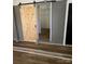 This shot features a barn door that leads into another room at 6372 Morehead St, Harrisburg, NC 28075