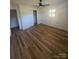 This bedroom features a ceiling fan, a closet, and a window to let natural light in at 6372 Morehead St, Harrisburg, NC 28075