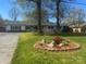 Charming single-story home with well-maintained lawn and a decorative rock garden at 6372 Morehead St, Harrisburg, NC 28075