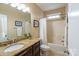 Well-lit bathroom featuring a granite countertop and combination tub/shower at 641 Weyburn Nw Dr, Concord, NC 28027