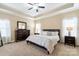 Serene bedroom features tray ceilings, neutral carpet, and ample natural light at 641 Weyburn Nw Dr, Concord, NC 28027