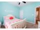 Bright bedroom with bright turquoise walls and coordinated decor at 641 Weyburn Nw Dr, Concord, NC 28027