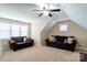 Spacious bonus room features two comfortable sofas, a ceiling fan and natural light from the window at 641 Weyburn Nw Dr, Concord, NC 28027