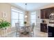 Inviting breakfast nook with a round table, pendant lighting, and ample natural light at 641 Weyburn Nw Dr, Concord, NC 28027