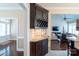 Elegant butler's pantry with wine rack and granite countertop in a neutrally decorated home at 641 Weyburn Nw Dr, Concord, NC 28027