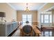 Bright dining room with modern lighting fixture and elegant trim, perfect for Gathering gatherings at 641 Weyburn Nw Dr, Concord, NC 28027