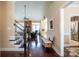 Open foyer showcasing hardwood floors, stairway, and a glimpse into the living room and dining areas at 641 Weyburn Nw Dr, Concord, NC 28027