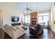 Cozy living room features a stone fireplace, high ceilings, and hardwood floors at 641 Weyburn Nw Dr, Concord, NC 28027