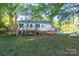 The backyard features a wooden deck for outdoor relaxation at 676 Forest Nw St, Concord, NC 28025