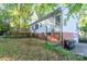 Backyard view of the home's deck, and landscaping at 676 Forest Nw St, Concord, NC 28025