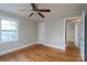 Bright bedroom with hardwood floors, ceiling fan, and neutral paint at 676 Forest Nw St, Concord, NC 28025