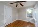 Charming bedroom with hardwood floors, neutral paint, and a ceiling fan at 676 Forest Nw St, Concord, NC 28025