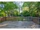 A wooden deck provides outdoor living space and overlooks the backyard at 676 Forest Nw St, Concord, NC 28025