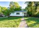 Charming home featuring a well-maintained lawn and inviting walkway up to the front door at 676 Forest Nw St, Concord, NC 28025