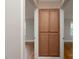 Hallway featuring a built-in wooden storage cabinet and hardwood floors at 676 Forest Nw St, Concord, NC 28025
