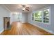 Bright living room with hardwood floors, fireplace, and large windows at 676 Forest Nw St, Concord, NC 28025