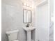 Modern bathroom features new fixtures, marble tile and a sleek design at 678 Wagner St, Troutman, NC 28166