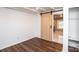 Bedroom features vinyl flooring, fresh paint, and a sliding barn door at 678 Wagner St, Troutman, NC 28166