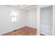 Bedroom features hardwood floors, a closet, an entry door, and a window at 678 Wagner St, Troutman, NC 28166