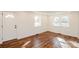 Living room features two windows and updated vinyl flooring at 678 Wagner St, Troutman, NC 28166