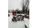 Winter view of a snowy backyard and patio area with fire pit at 705 3Rd Nw Ave, Hickory, NC 28601