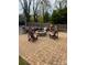 Backyard featuring a stone patio and outdoor fireplace with chairs at 705 3Rd Nw Ave, Hickory, NC 28601