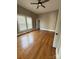 Bedroom with hardwood floors, a ceiling fan, and a bright window at 705 3Rd Nw Ave, Hickory, NC 28601