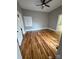 Bright bedroom with hardwood floors, neutral walls, and a ceiling fan at 705 3Rd Nw Ave, Hickory, NC 28601